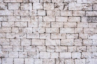 Eski beyaz taş tuğla duvar.