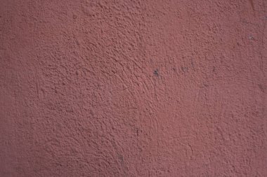 Kırmızı beton duvar dokusu ile siyah nokta.