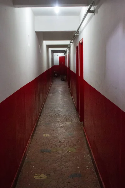 Red and white corridor. No people.