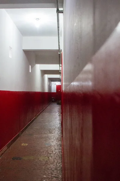 Red and white corridor. No people.