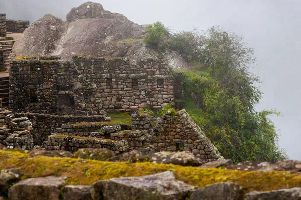 A rock, ancient ruins and clouds in the mountains. — Stock Photo, Image