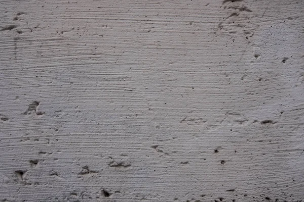 Antiguo muro blanco de hormigón con agujeros . — Foto de Stock