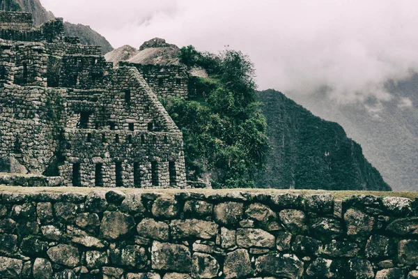 Beautiful view of Inca ancient ruins on a cliff.