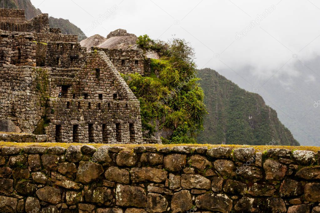 Beautiful view of Machu Picchu ruins on a cliff.