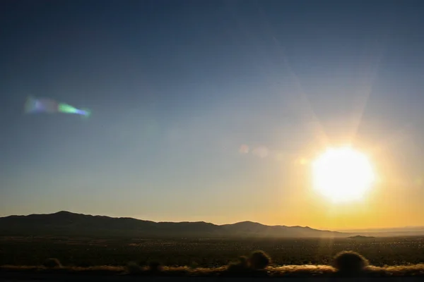 stock image Sun setting on the landscape of the Nevada desert. Perfect wallpaper.