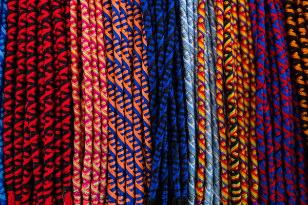 Multicolored friendship bracelets background. — Stock Photo, Image