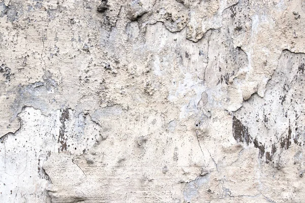 Gri ve sarı lekeler doku soyma boya ile gri eski duvar. Tasarım için arka plan.