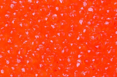 Arka plan olarak kırmızı havyar yakın çekim.