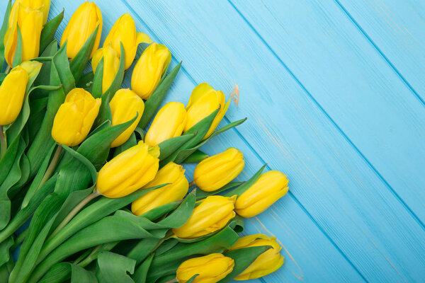 tulips on wood background