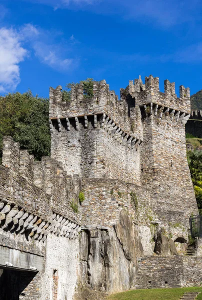 Ancient city wall with watch tower of the old fortress Grande Castle in Bellinzone, Switzerland