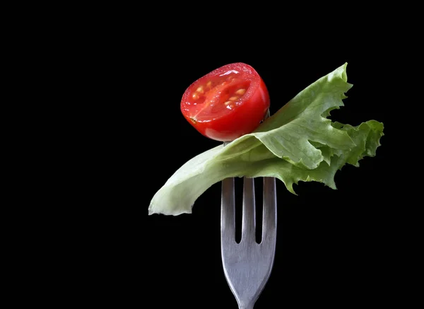 丰杜叉子上的食物系列 樱桃番茄和沙拉叶 — 图库照片