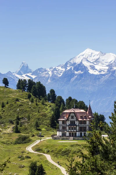 Villa Cassel - the Pro Nature Center for the Great Aletsch Glacier region in summer with Matterhorn peak at the background. The building was built in 1902 in Victorian architecture style.