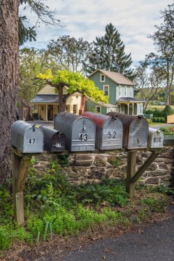 TINICUM, PENNSYLVANIA - OCTOBER 16 -United States Postal Service RFD mail boxes as seen on October 16 2018 in Tinicum Township Bucks County Pennsylvania. clipart