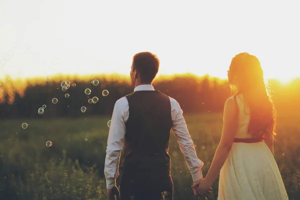 Bride Groom Hold Hands Walk Park Sunset Light Bubble Wedding — Stock Photo, Image