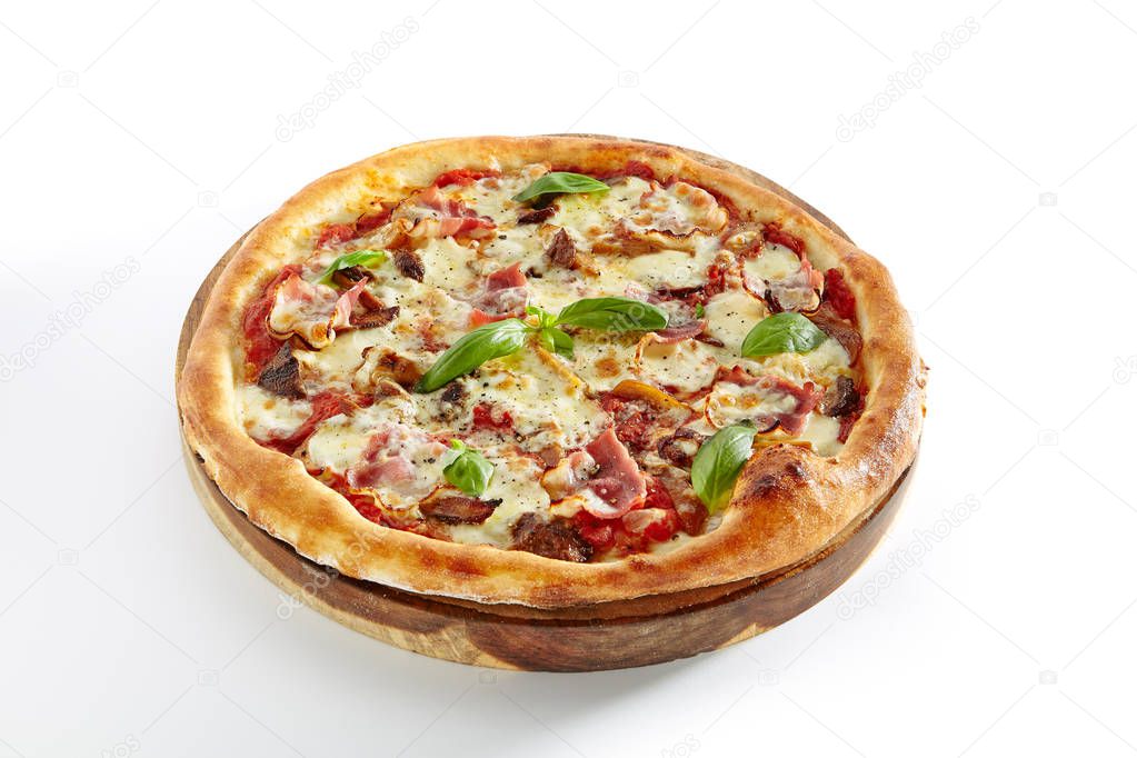 Canadian Pizza or Regina with Bacon, Tomatoes, Boletus Mushrooms, Fresh Basil, Tomato Sauce and Mozzarella Isolated on White Background. Traditional Italian Whole Flatbread on Wooden Plate Close Up