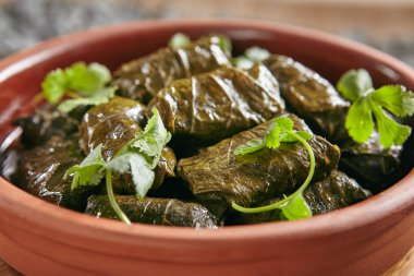 Dolma, Sarma or Dolmades Stuffed with Lamb and Rice Close Up with Selective Focus. Homemade Dolmades, Dolmadakia or Tolma with Mutton Meat and Marinated Vine Leaves clipart