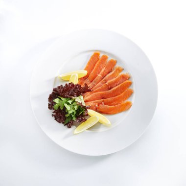 Slightly Salted Salmon Fillet with Lemon and Greens clipart