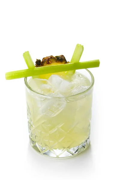 Alcohol Cocktail with Pineaple and Celery in a Crystal Glass Iso — Stock Photo, Image