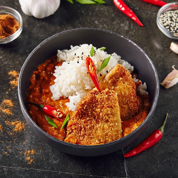 Hot Spicy Crispy Fried Pork Fillet with Curry and Rice on Dark B — Stock Photo, Image