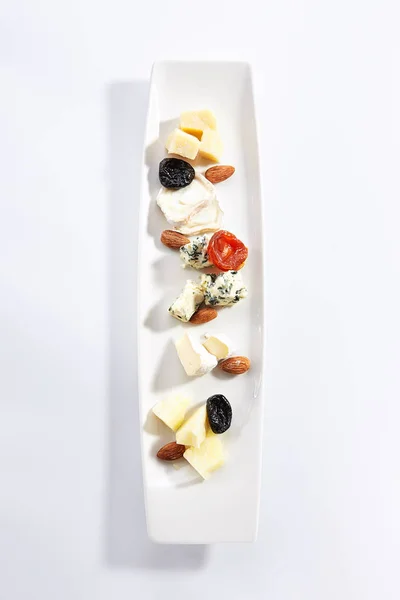 Cheese assorti platter top view — Stock Photo, Image