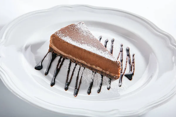 Macro Shot of Chocolate Cheesecake on White Plate Izolat — Fotografie, imagine de stoc