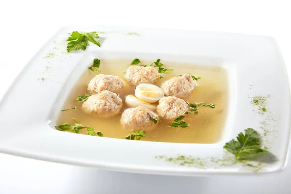 Chicken Soup with Meatballs Decorated with Boiled Quail Egg