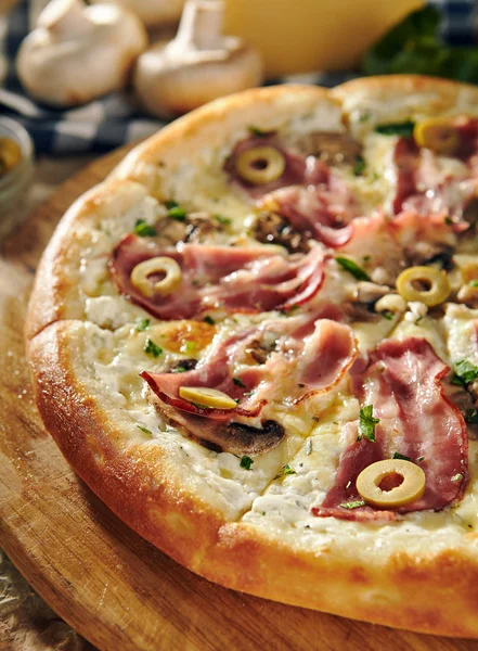 Pizza Restaurant Menu - Delicious Fresh Pizza with Bacon and Olives. Pizza on Rustic Wooden Table with Ingredients