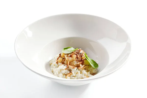 Risotto with roasted pear and almond closeup — Stock Photo, Image