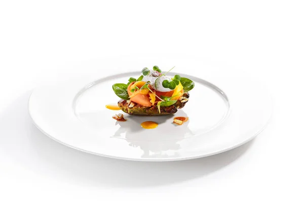 Exquisite serving avocado with mozzarella cream and dried tomato — Stock Photo, Image