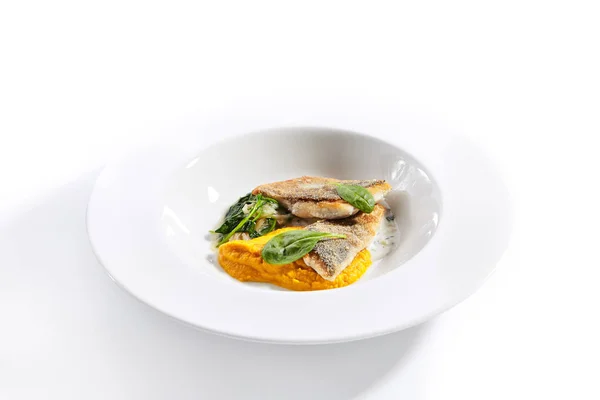 Cod fillet with pumpkin puree and spinach closeup — ストック写真