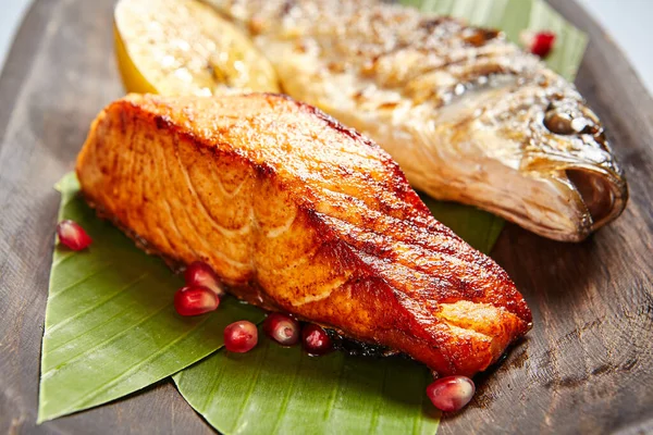 Fish Served Wooden Rustic Plate Grilled Seabass Salmon Piece Plant — Stock Photo, Image