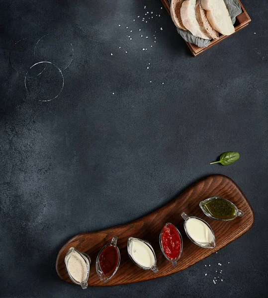 Assortment Sauce Wooden Board Black Slate Table Top View Bread — Stock Photo, Image