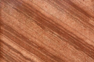 Sıcak cardı renklerde diyagonal çizgili mermer taş closeup.