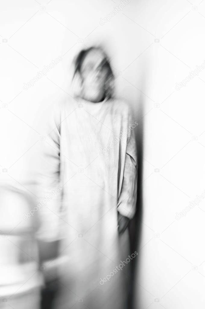 Creative image of woman in motion blur to illustrate anxiety.