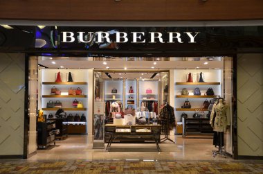 SINGAPORE- 20 JUN, 2018: Burberry store at Singapore Changi Airport. Burberry Group, Inc., is a British luxury fashion house. clipart