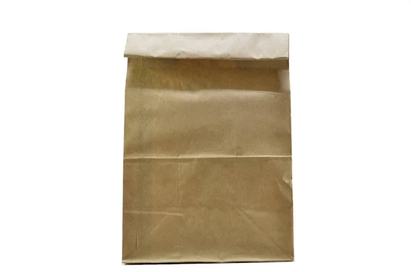 在白色背景上孤立的棕色纸包 — 图库照片