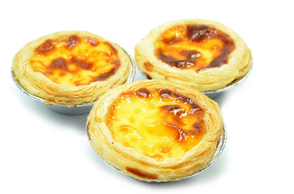 Fresh baked egg tarts or custard tarts isolated on white background