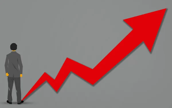 Businessman thinking of the growing red graph