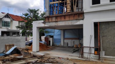 Johor Bahru 'da inşaat alanı ve tuğla ev eklentisi