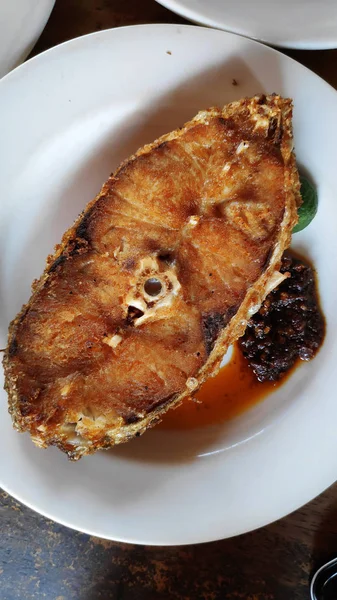 Fried fish fillet in a plate — Stock Photo, Image