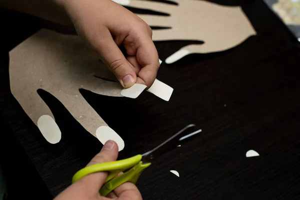 Play at home. kid on paper hand applying painting. manicure salon. educational creative lesson.