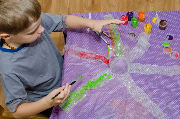 Plastic bottle and bubble wrap octopus painted with gouache. Montessori material. Education through the game. Make it at home.