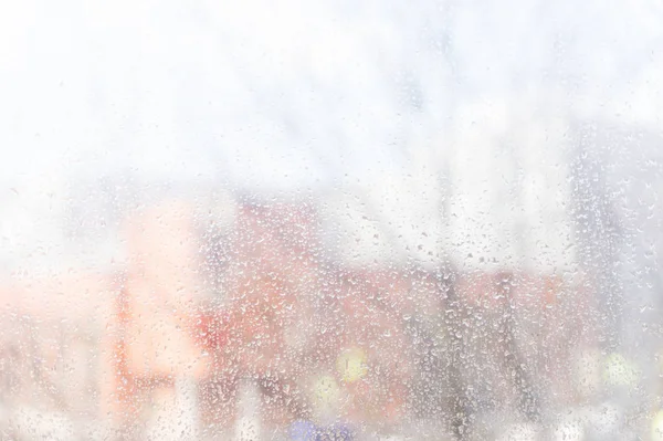 Yağmur damlaları pencere cam, arka plan üzerinde 