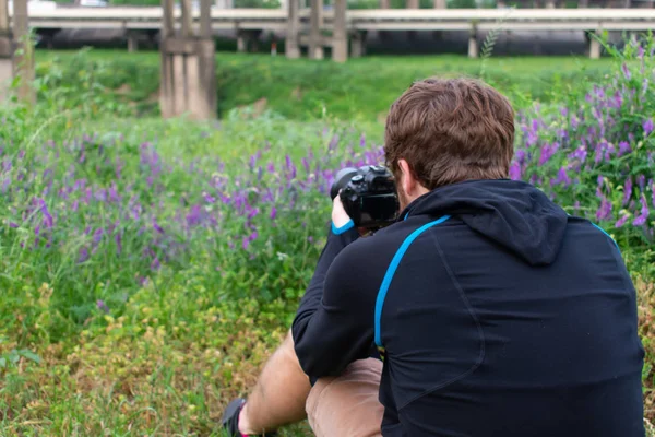 Man Taking Pictures of Texas bluebonnets