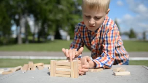 Little Blond Boy Teenager Plays Wooden Cubes Summer Park — Stock Video