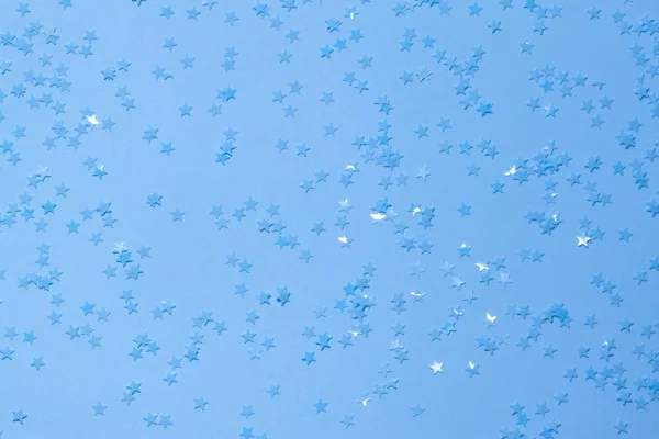 Lentejuelas Azules Sobre Fondo Azul Con Confeti Como Asteriscos —  Fotos de Stock