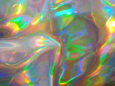 Holografik parlak gökkuşağı çok renkli gerçek buruşuk doku arkaplanı.
