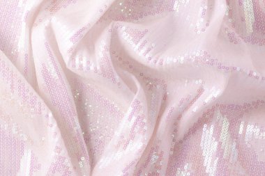 Large shiny glossy pink sequins background. clipart
