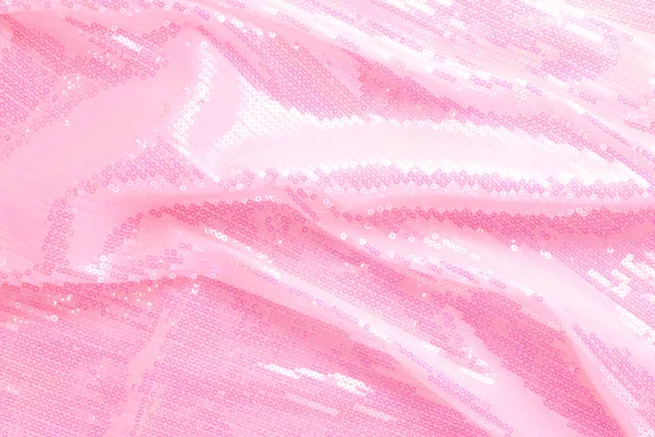 Large shiny glossy pink sequins background.