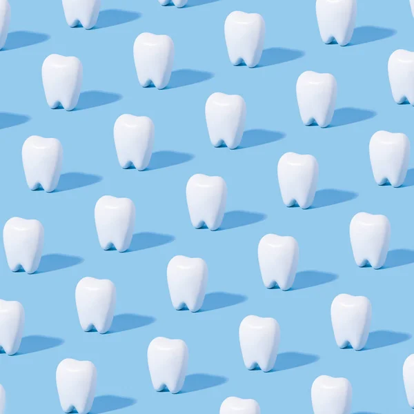 White teeth pattern on a blue paper background.